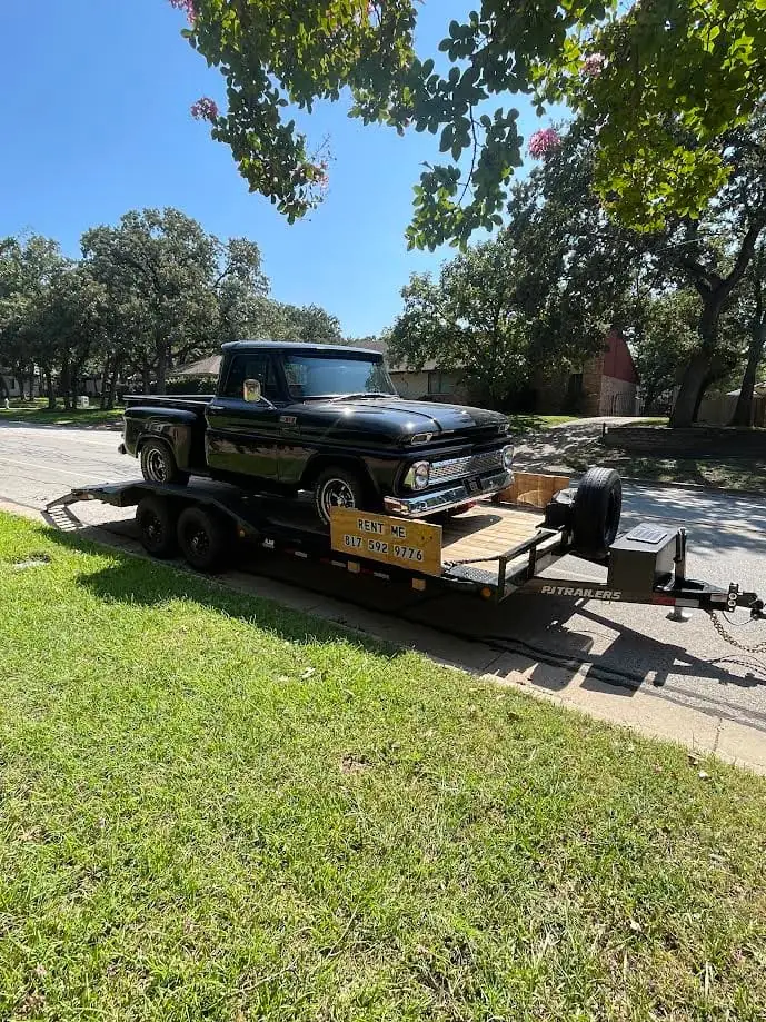Black classic pickup truck loaded on the PJ 20 ft car hauler trailer